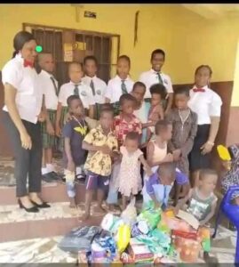 a group with gifts visit to the orphanage