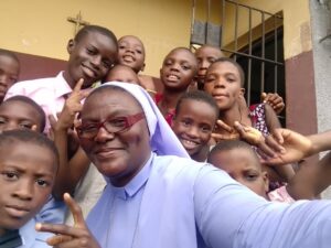 sr with the children smiling